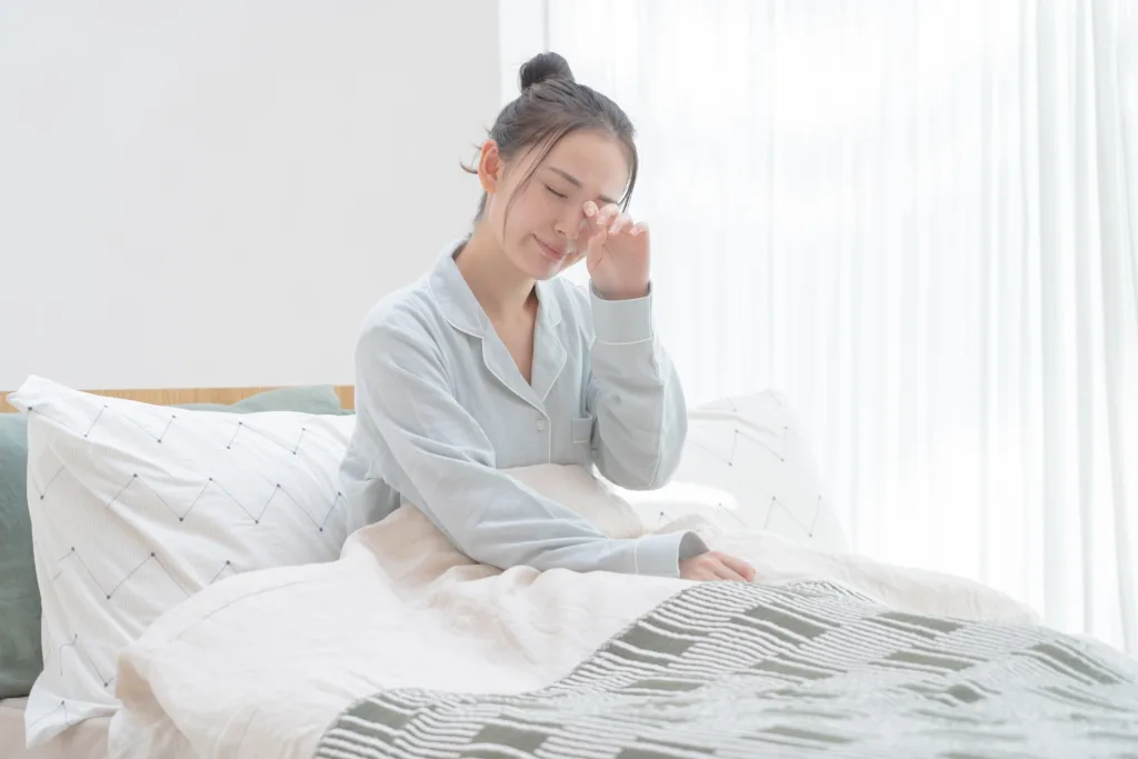 睡眠不足で困っている女性