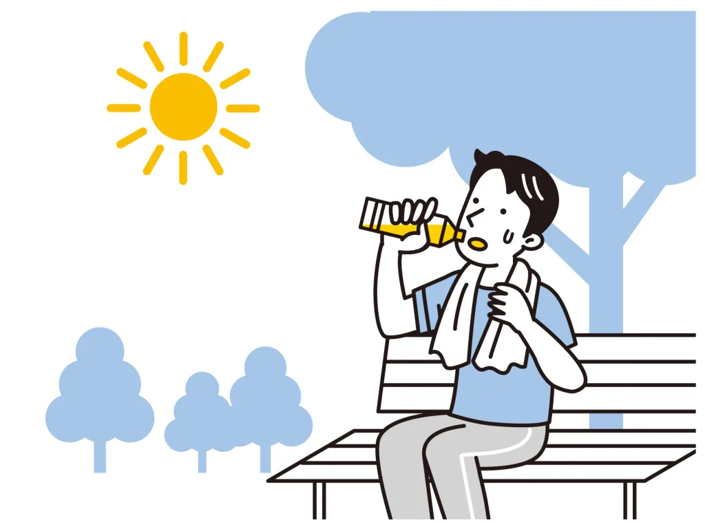 外で水飲む男性