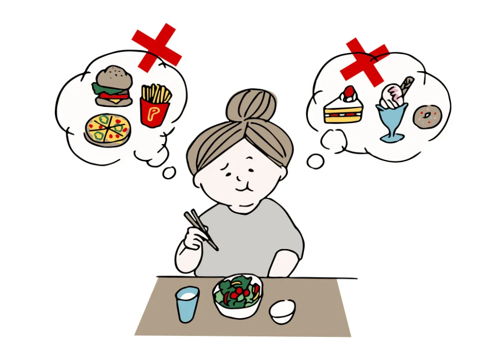 食べたい物我慢してサラダ食べる女性