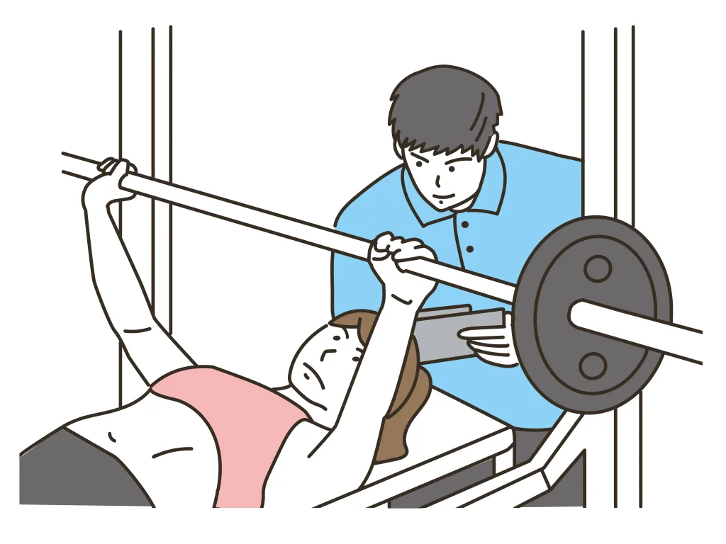 男性トレーナーとベンチプレスをする女性