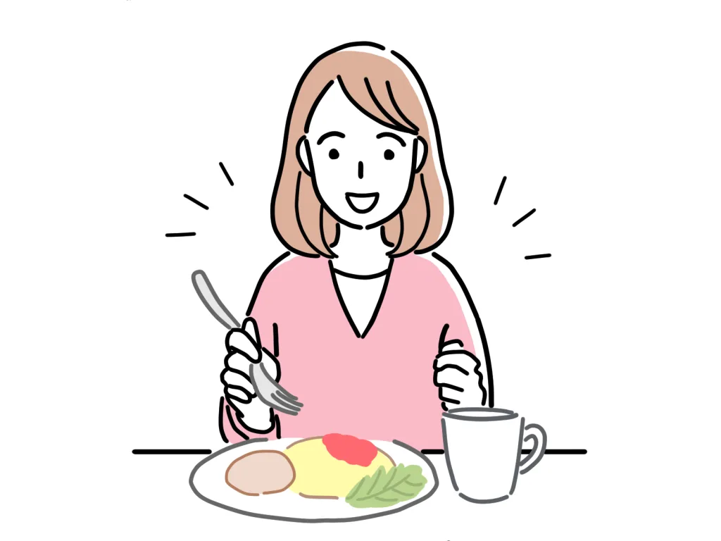 笑顔で食事する女性