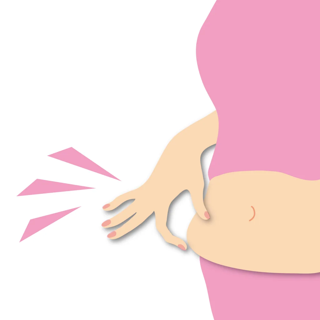 ぽっこりお腹を気にする女性