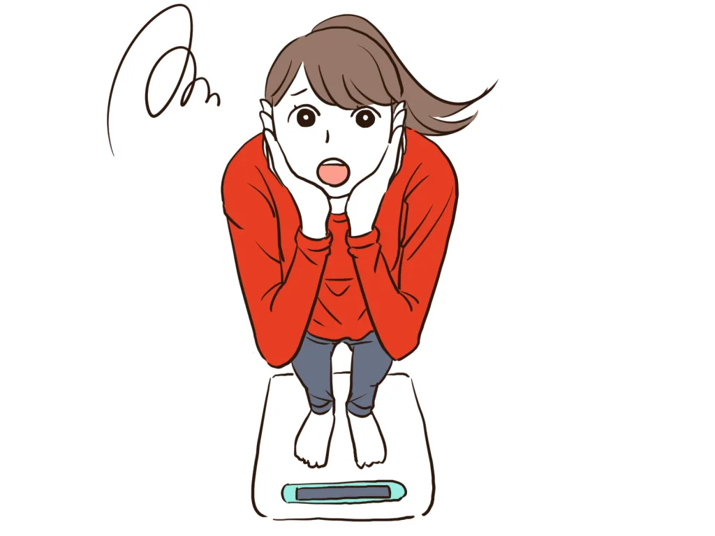 体重計に乗る女性