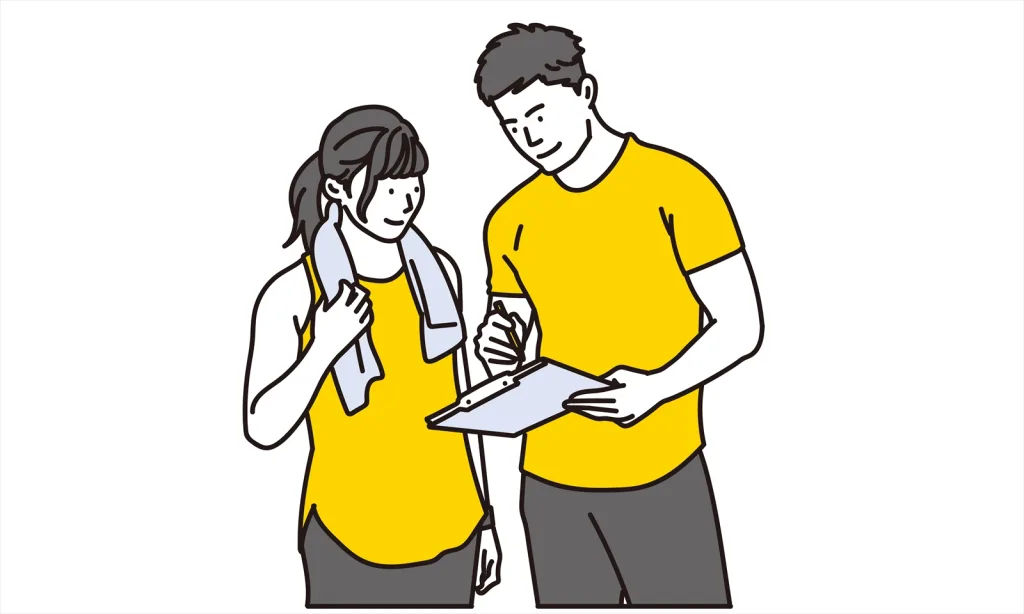 トレーナーに指示をもらう女性