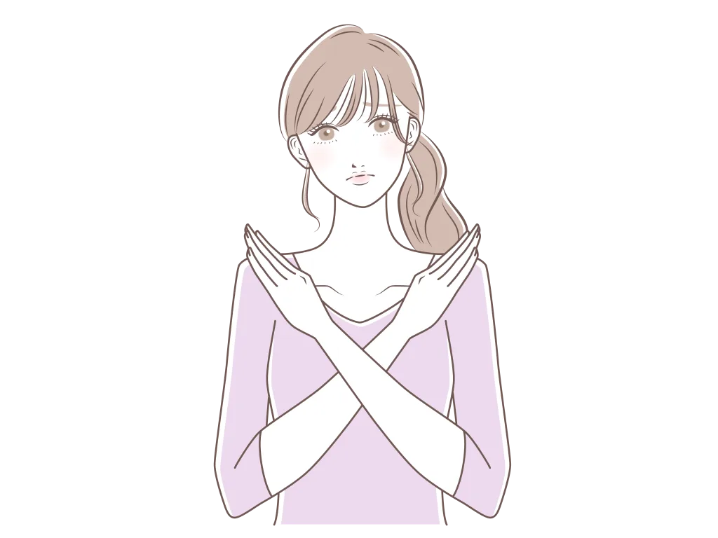 バツポーズの女性